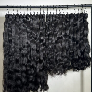 Black Woman wearing long raw human hair extensions premium unprocessed hair texture for SPadtress raw vs virgin hair comparison